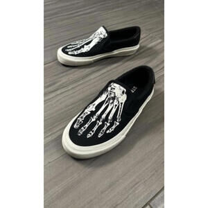 Black Slip-On Shoes with White Skeleton Footprint Design